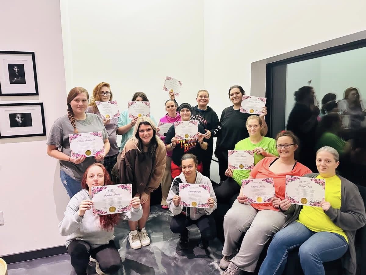 LifeSource residents celebrating program completion with certificates
